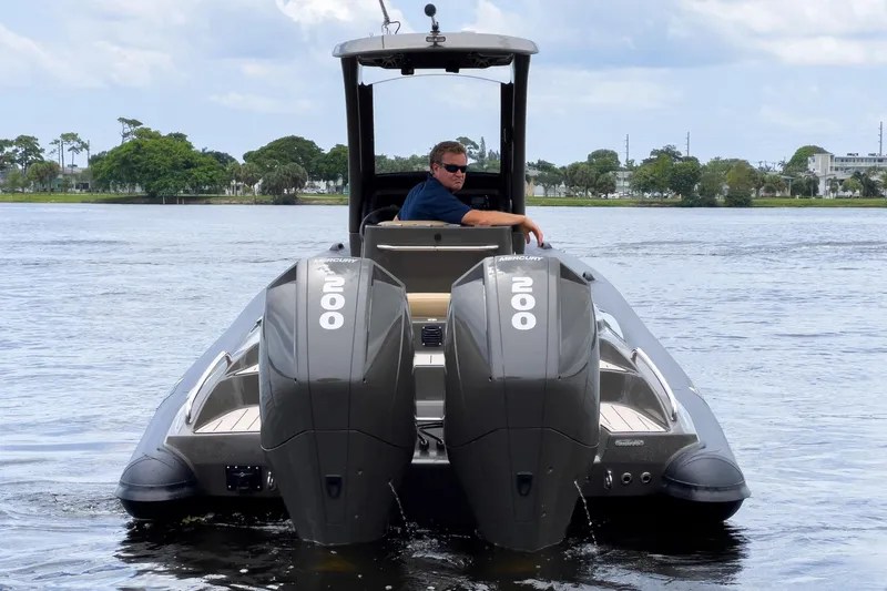 Airship 310 Yacht Photos Pics 2023 Airship 310 boat with dual Mercury 200 engines on a calm lake.