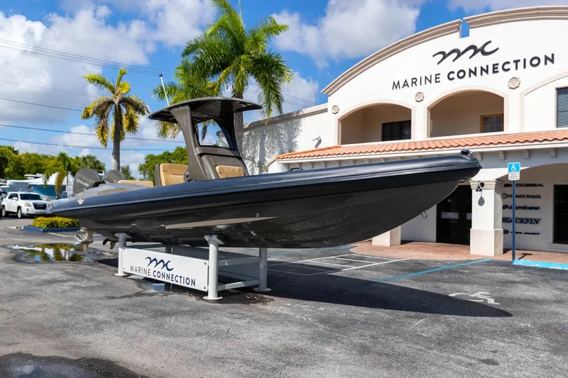 Airship 310 Yacht Photos Pics 2023 Airship 310 boat displayed at Marine Connection dealership under clear blue sky.