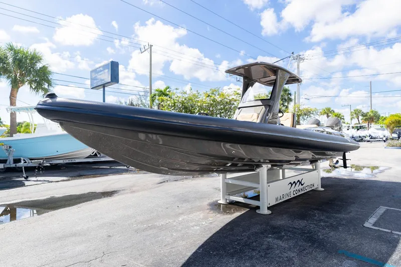 Airship 310 Yacht Photos Pics 2023 Airship 310 boat displayed at Marine Connection dealership under clear skies.