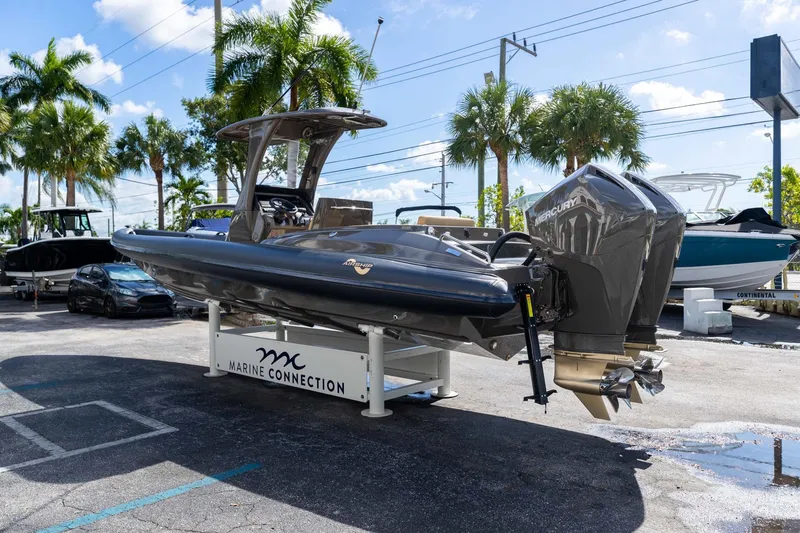 Airship 310 Yacht Photos Pics 2023 Airship 310 boat displayed at Marine Connection dealership with twin Mercury engines.