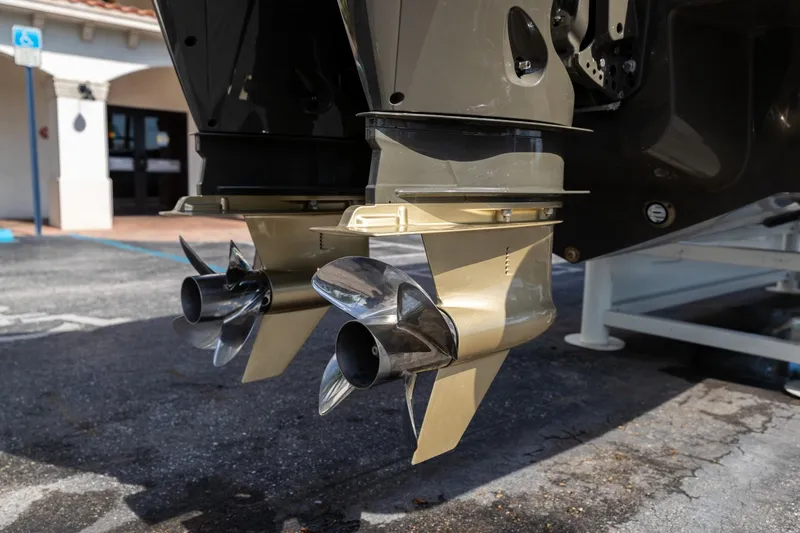 Airship 310 Yacht Photos Pics Close-up of 2023 Airship 310 boat propellers on a trailer in a parking lot.