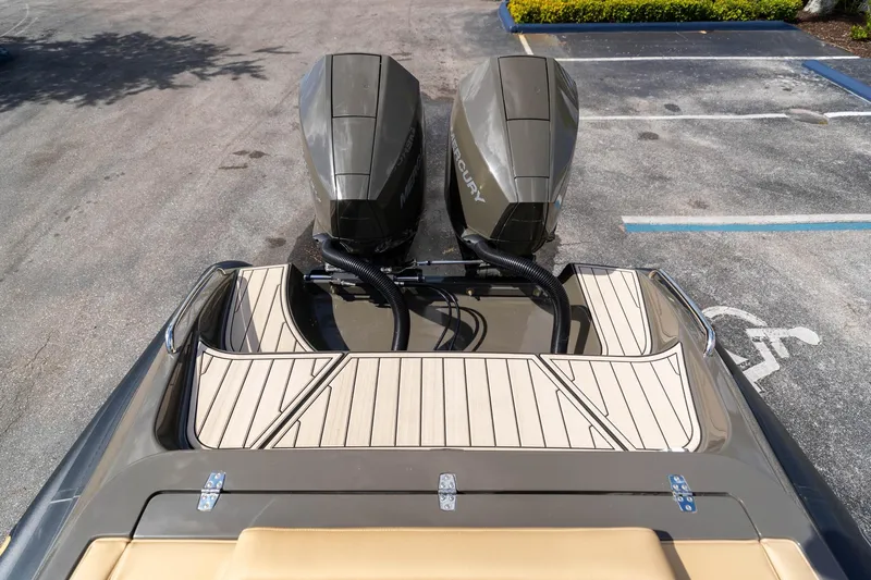 Airship 310 Yacht Photos Pics 2023 Airship 310 boat with dual Mercury outboard motors in a parking lot.