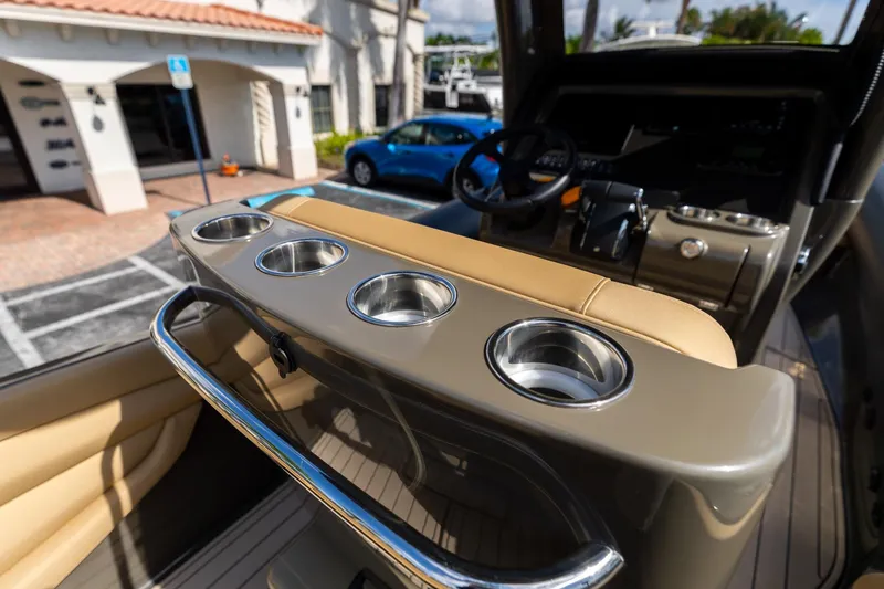 Airship 310 Yacht Photos Pics Interior of 2023 Airship 310 boat with cup holders and steering wheel.