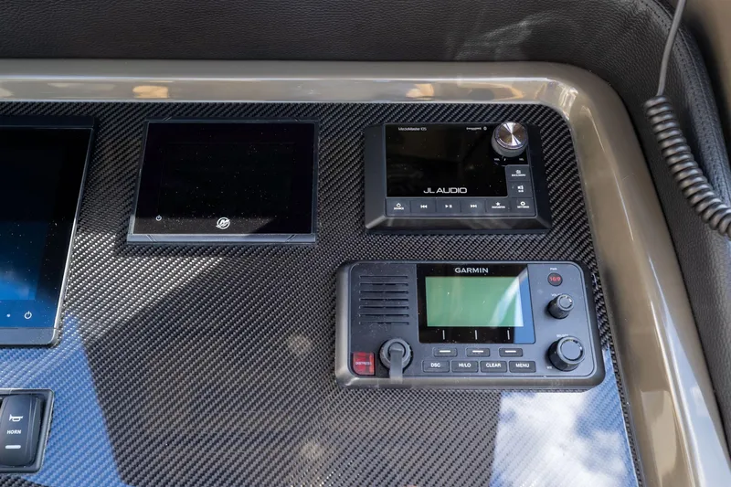 Airship 310 Yacht Photos Pics Control panel of 2023 Airship 310 featuring JL Audio and Garmin devices.