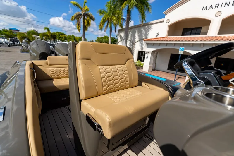 Airship 310 Yacht Photos Pics Luxurious seating on 2023 Airship 310 boat, featuring tan upholstery and modern design.