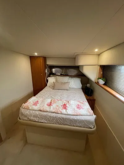 Scott Free & Gigi Too Yacht Photos Pics 2002 Silverton 392 Motor Yacht bedroom with cozy bed and ambient lighting.