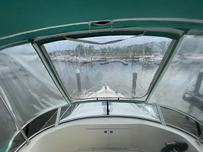 Scott Free & Gigi Too Yacht Photos Pics View from 2002 Silverton 392 Motor Yacht cockpit, overlooking marina with clear canopy.