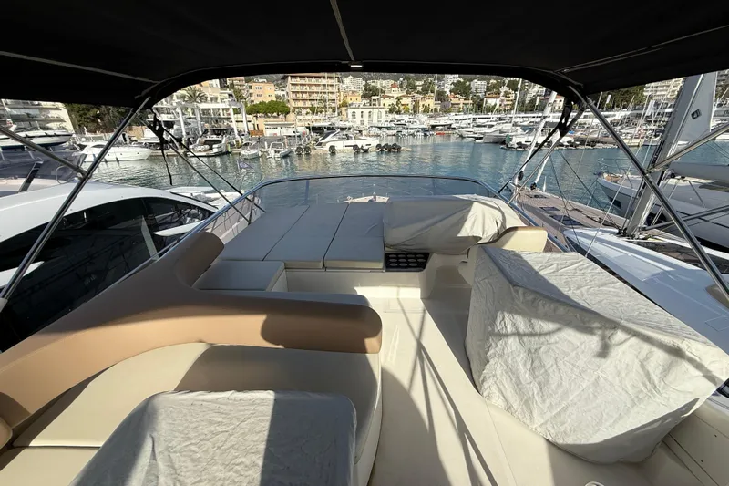  Yacht Photos Pics Flybridge view of 2015 Absolute 56 FLY yacht docked in a marina.