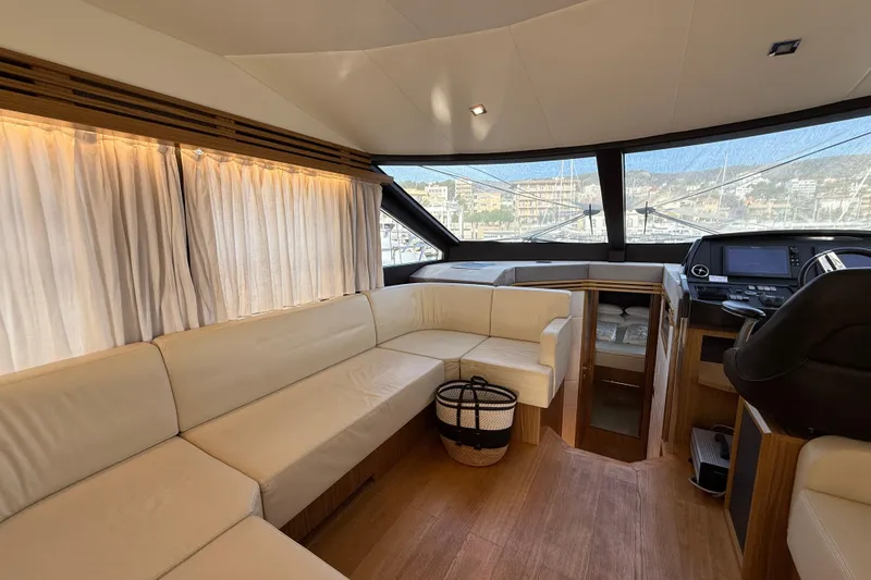  Yacht Photos Pics Luxurious interior of 2015 Absolute 56 FLY yacht with leather seating and panoramic windows.