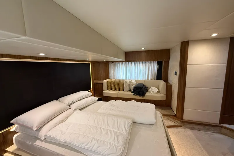  Yacht Photos Pics Luxurious bedroom interior of 2015 Absolute 56 FLY yacht with modern design and cozy seating.