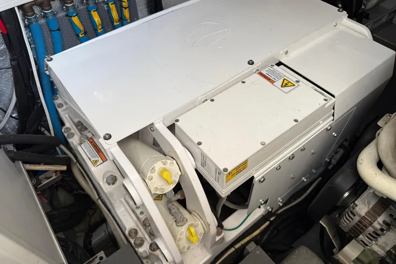  Yacht Photos Pics Engine compartment of a 2015 Absolute 56 FLY yacht, showcasing mechanical components.