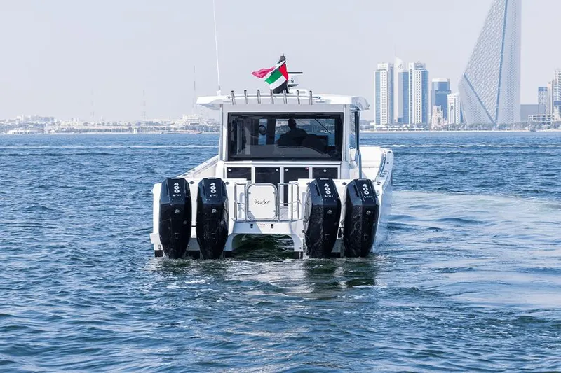  Yacht Photos Pics 2026 SilverCAT 46WA boat with four engines cruising near city skyline.