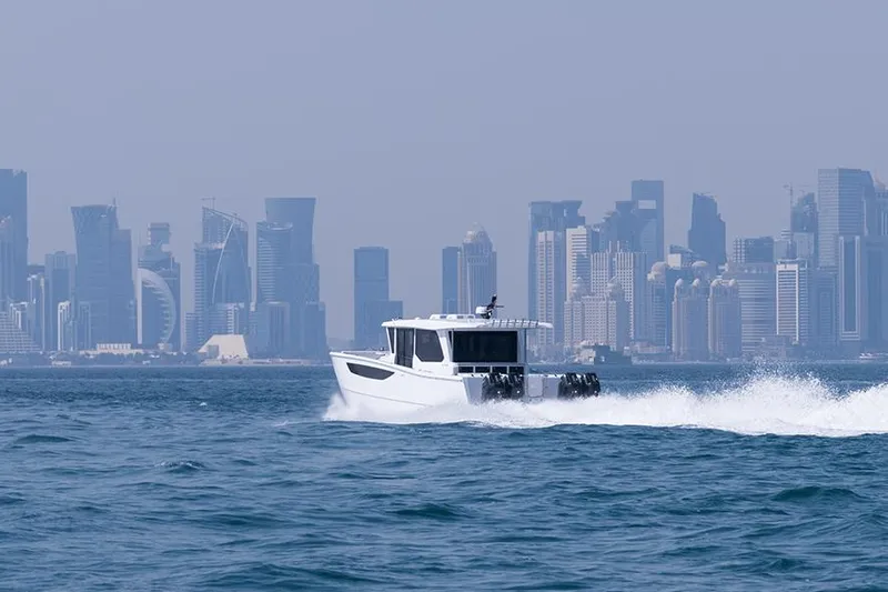  Yacht Photos Pics SilverCAT 46WA boat cruising near a city skyline, 2026 model.