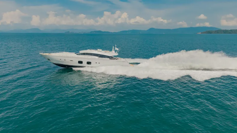 Le Caprice IV Yacht Photos Pics Luxurious 2011 Pershing 108 yacht cruising swiftly on open blue sea.