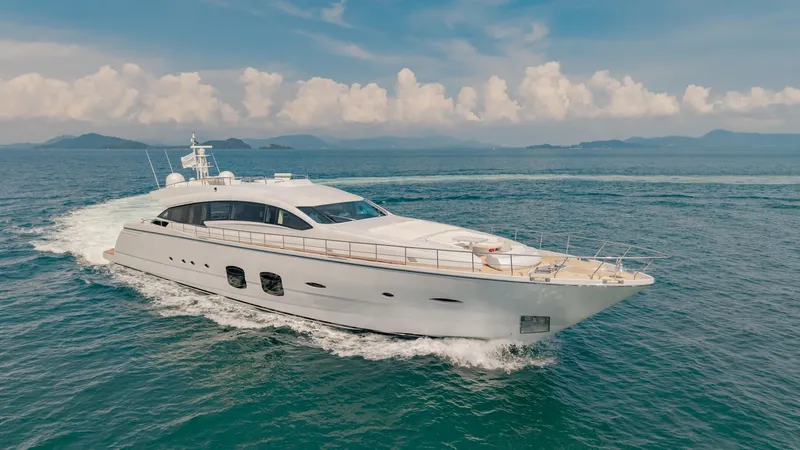 Le Caprice IV Yacht Photos Pics Luxurious 2011 Pershing 108 yacht cruising on open sea under clear skies.