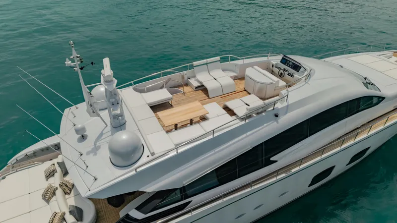 Le Caprice IV Yacht Photos Pics Luxury 2011 Pershing 108 yacht on turquoise water, featuring spacious deck and modern design.