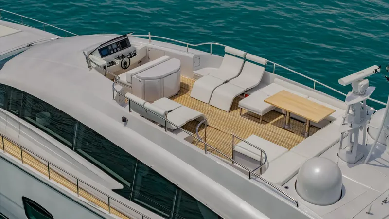 Le Caprice IV Yacht Photos Pics Luxurious 2011 Pershing 108 yacht deck with seating, table, and ocean view.