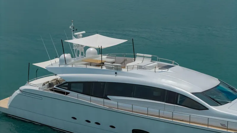 Le Caprice IV Yacht Photos Pics Luxury Pershing 108 yacht, 2011 model, cruising on calm blue waters.