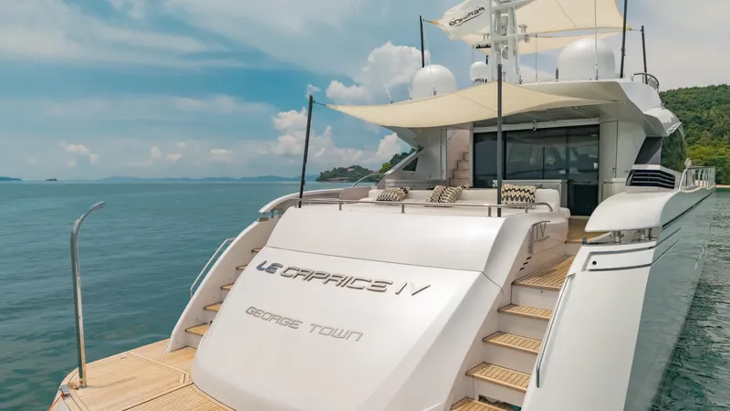 Le Caprice IV Yacht Photos Pics Luxury Pershing 108 yacht from 2011 docked in serene waters.