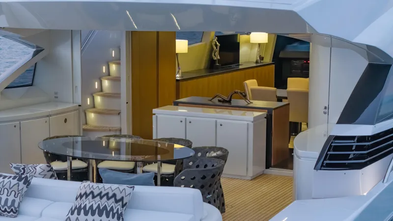 Le Caprice IV Yacht Photos Pics Luxurious interior of 2011 Pershing 108 yacht with elegant dining and seating area.