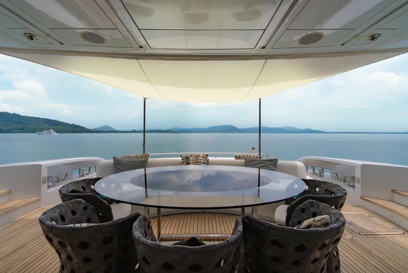 Le Caprice IV Yacht Photos Pics Luxurious Pershing 108 yacht deck with elegant seating and ocean view, 2011 model.