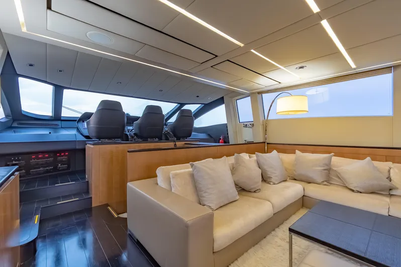 Le Caprice IV Yacht Photos Pics Luxurious interior of 2011 Pershing 108 yacht with plush seating and modern helm.