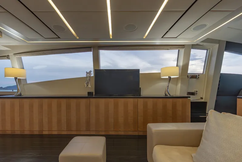 Le Caprice IV Yacht Photos Pics Luxurious interior of 2011 Pershing 108 yacht with modern decor and large windows.