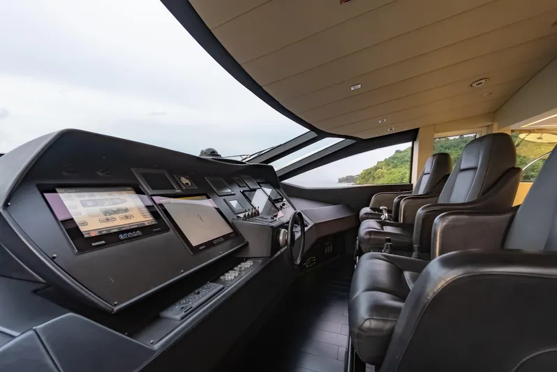 Le Caprice IV Yacht Photos Pics Luxurious 2011 Pershing 108 yacht cockpit with modern navigation systems and leather seating.