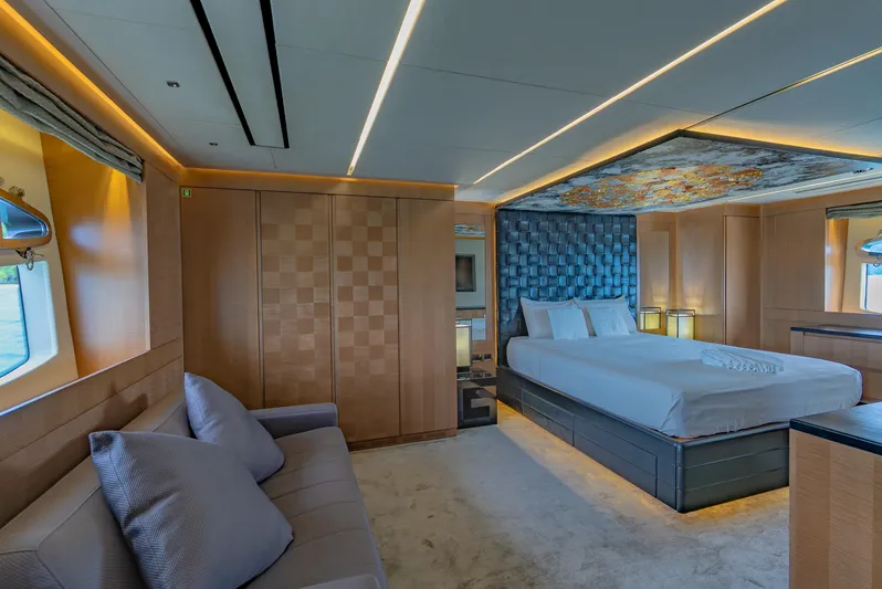 Le Caprice IV Yacht Photos Pics Luxurious bedroom interior of 2011 Pershing 108 yacht with modern design and ambient lighting.