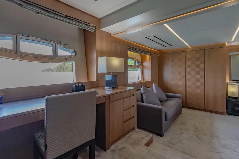 Le Caprice IV Yacht Photos Pics Luxurious interior of 2011 Pershing 108 yacht with modern furnishings and large windows.