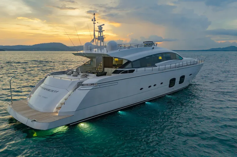 Le Caprice IV Yacht Photos Pics Luxurious 2011 Pershing 108 yacht cruising at sunset, featuring sleek design and elegant lighting.