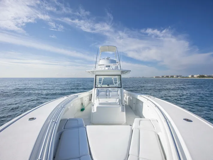  Yacht Photos Pics 2016 Yellowfin 42 boat on open sea under clear blue sky.
