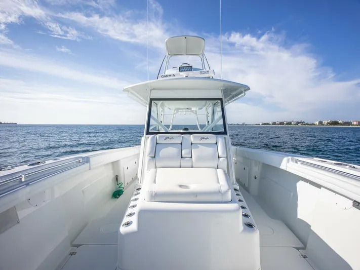  Yacht Photos Pics 2016 Yellowfin 42 boat on open water, clear sky, spacious deck.