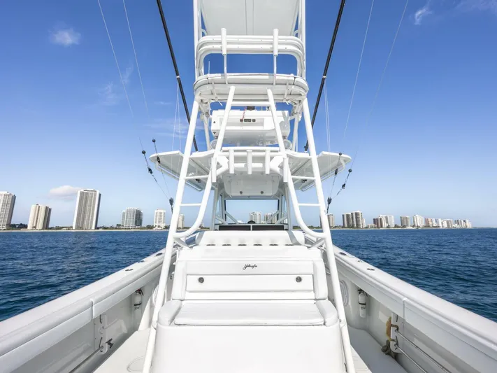  Yacht Photos Pics 2016 Yellowfin 42 boat on water with city skyline in background.