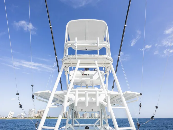  Yacht Photos Pics 2016 Yellowfin 42 boat tower against blue sky and ocean backdrop.