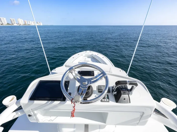  Yacht Photos Pics 2016 Yellowfin 42 boat helm with ocean view and city skyline.