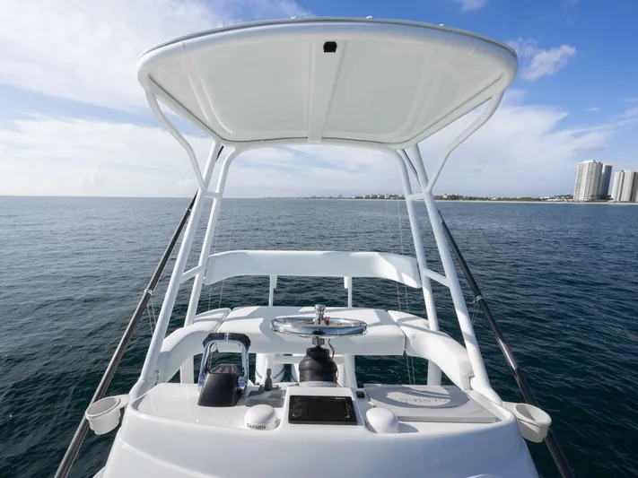  Yacht Photos Pics 2016 Yellowfin 42 boat helm with ocean view and distant city skyline.
