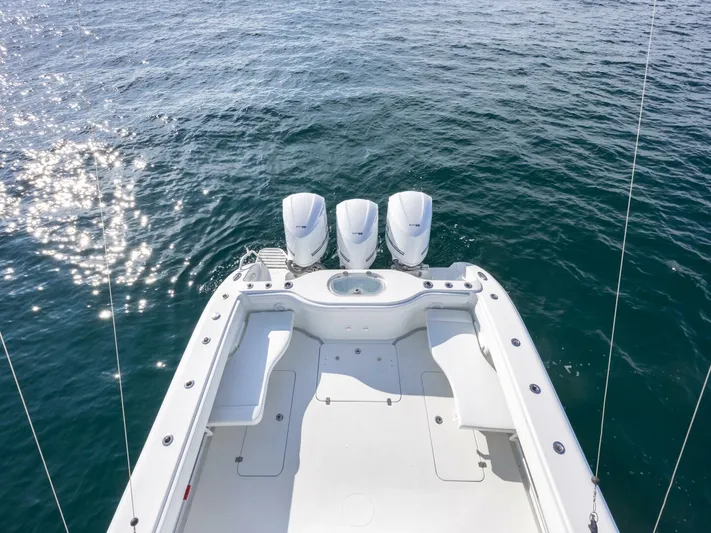  Yacht Photos Pics 2016 Yellowfin 42 boat with triple engines on calm water.