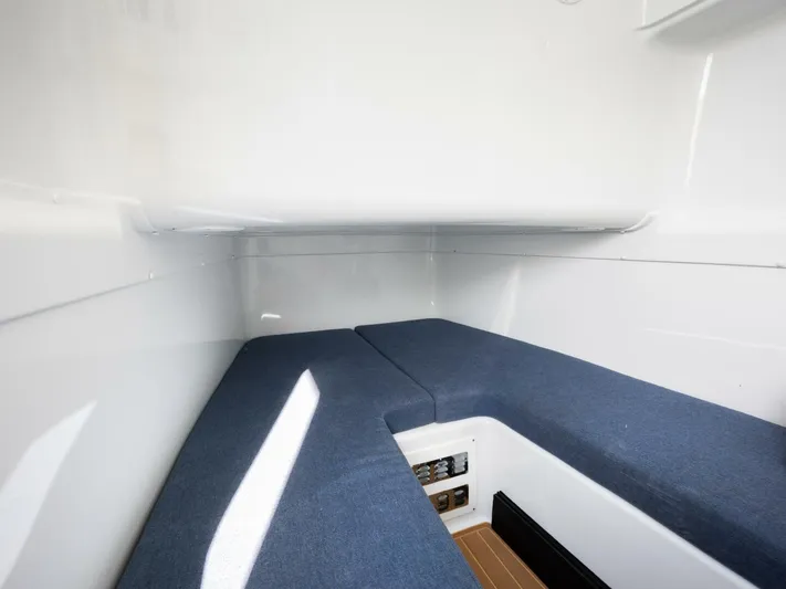  Yacht Photos Pics Interior cabin of 2016 Yellowfin 42 boat with blue cushioned seating.