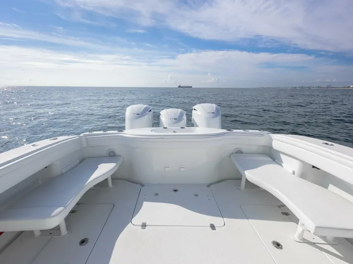  Yacht Photos Pics 2016 Yellowfin 42 boat with triple engines on open sea.