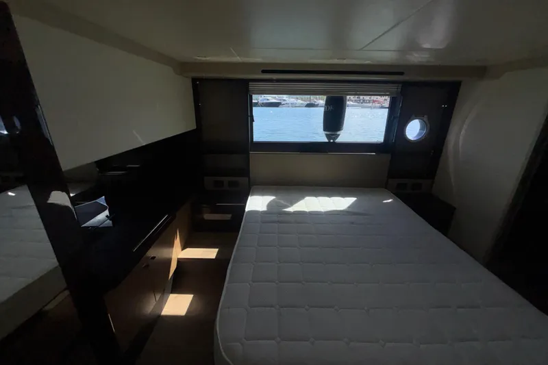  Yacht Photos Pics Luxurious cabin interior of 2023 Absolute 60 Fly yacht with waterfront view.