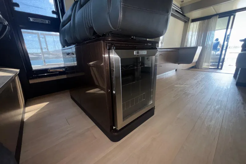  Yacht Photos Pics Luxurious interior of 2023 Absolute 60 Fly yacht with modern seating and sleek flooring.