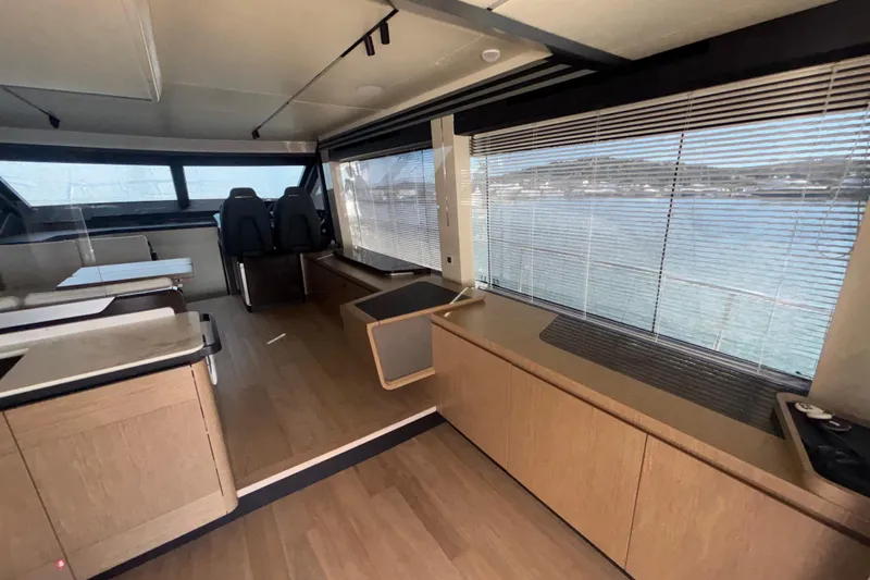  Yacht Photos Pics Interior of 2023 Absolute 60 Fly yacht with modern design and large windows.