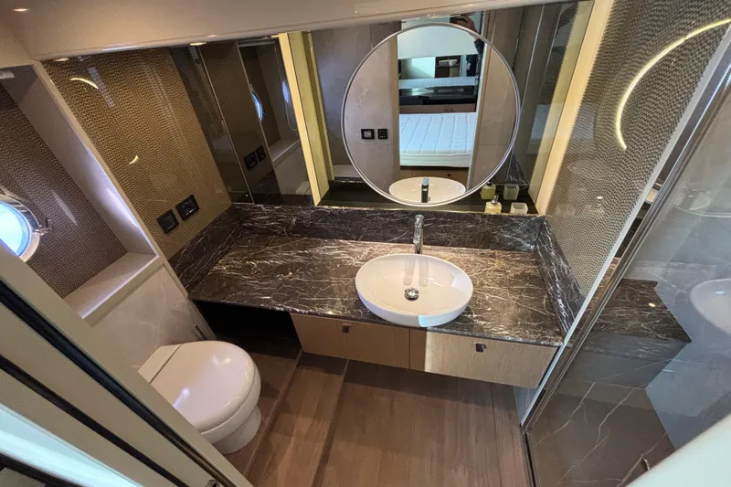 Lizok Yacht Photos Pics Luxurious bathroom in 2023 Absolute 60 Fly yacht with marble countertop and modern fixtures.