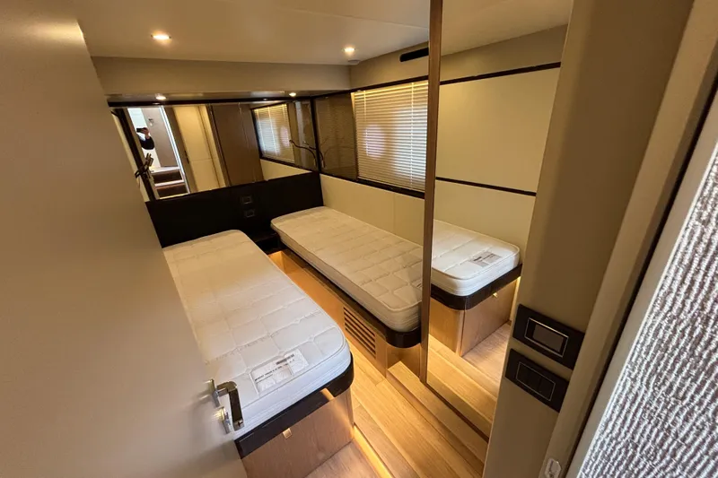 Lizok Yacht Photos Pics Luxurious twin cabin interior of 2023 Absolute 60 Fly yacht, featuring modern design and cozy beds.