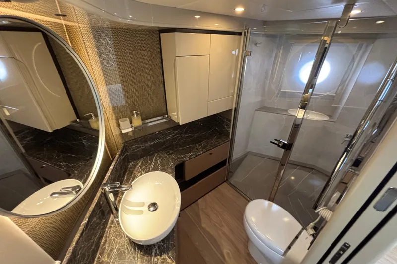 Lizok Yacht Photos Pics Luxurious bathroom in 2023 Absolute 60 Fly yacht with modern fixtures and elegant design.