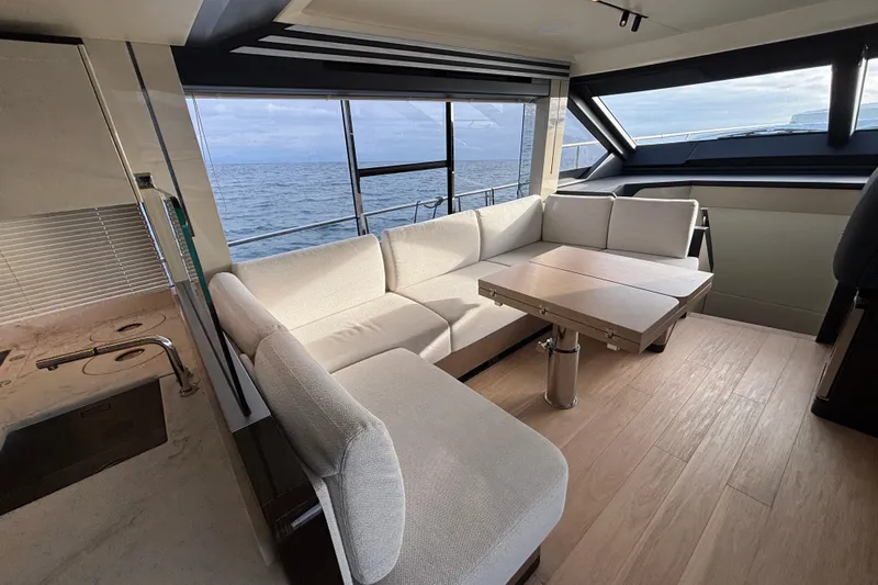 Lizok Yacht Photos Pics Luxurious interior of 2023 Absolute 60 Fly yacht with ocean view and modern furnishings.