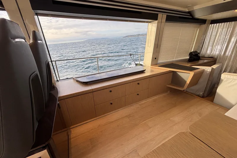 Lizok Yacht Photos Pics Luxurious interior of 2023 Absolute 60 Fly yacht with ocean view.