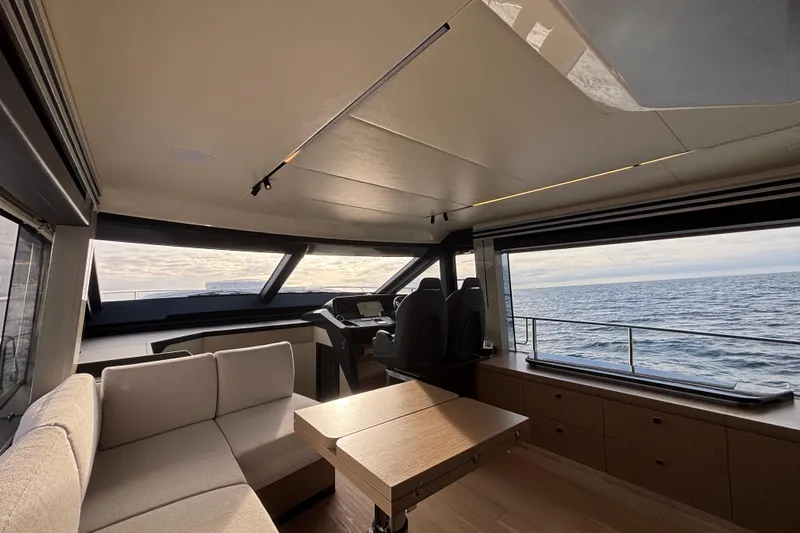Lizok Yacht Photos Pics Luxurious interior of 2023 Absolute 60 Fly yacht with ocean view and modern furnishings.