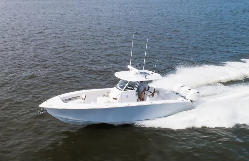  Yacht Photos Pics 2024 Jupiter 340LS boat cruising on open water, showcasing sleek design and powerful engines.